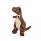 Dog playing with dinosaur plush chew toy