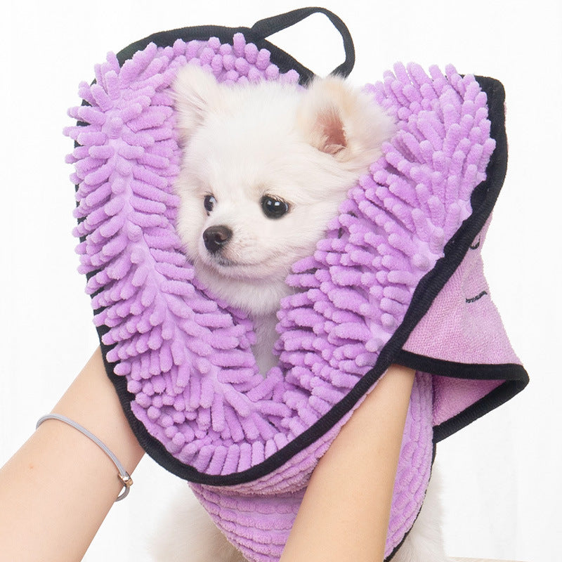 Dog wearing microfiber bathrobe towel after shower