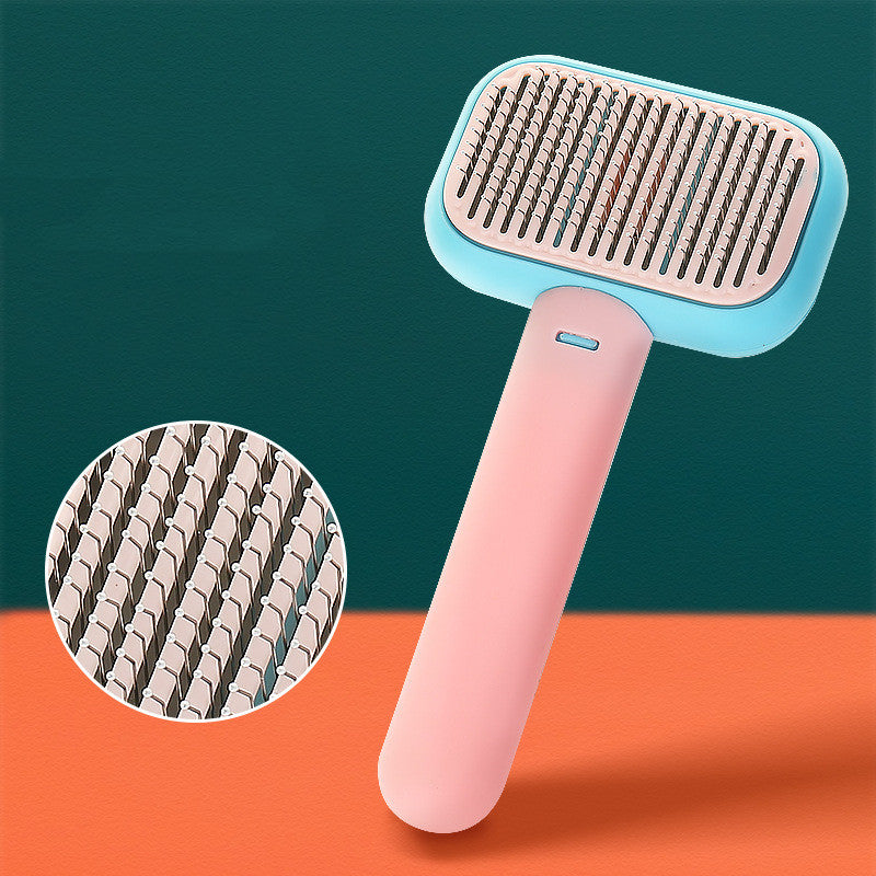 Pet grooming brush with easy grip handle