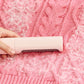 Pet hair remover brush cleaning fur from fabric sofa