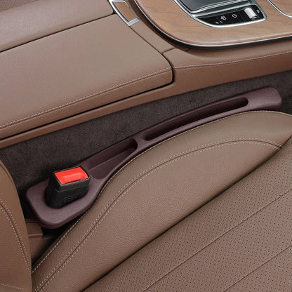 Car seat gap plug storage box and leak resistant strip for car interior