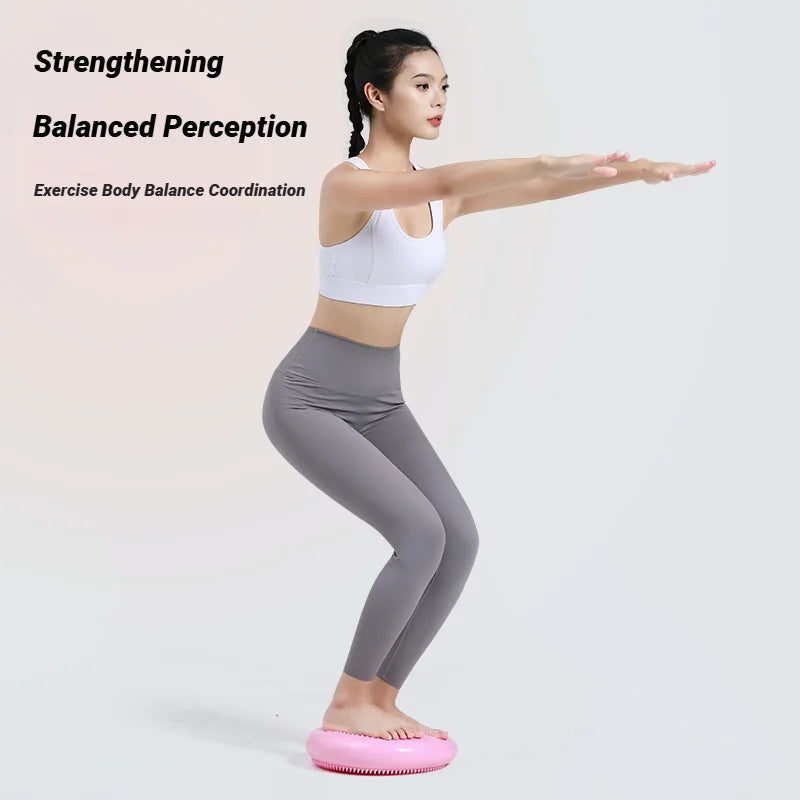 Woman using balance cushion for core exercise